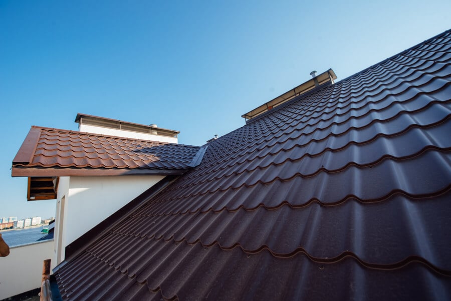Titan Exteriors displays various roofing and metal roofing options in a city landscape