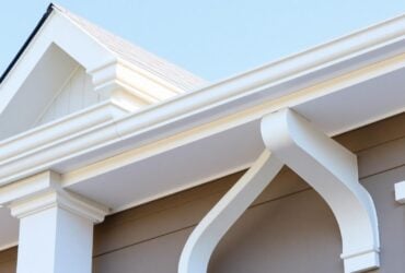 Detailed image of a house roof, highlighting the texture of shingles, featuring Titan Exteriors branding Detailed image of a house roof, highlighting the texture of shingles, featuring Titan Exteriors branding