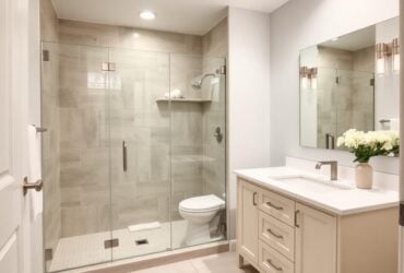 Modern bathroom layout showcasing a shower and toilet, created by Titan Exteriors. Modern bathroom layout showcasing a shower and toilet, created by Titan Exteriors.