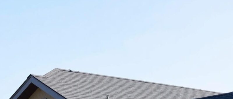 A house featuring a brick roof, showcasing the craftsmanship of Titan Exteriors.